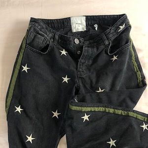 Black embroidered star jeans. ONE TEASPOON size 27 green ribbon down sides